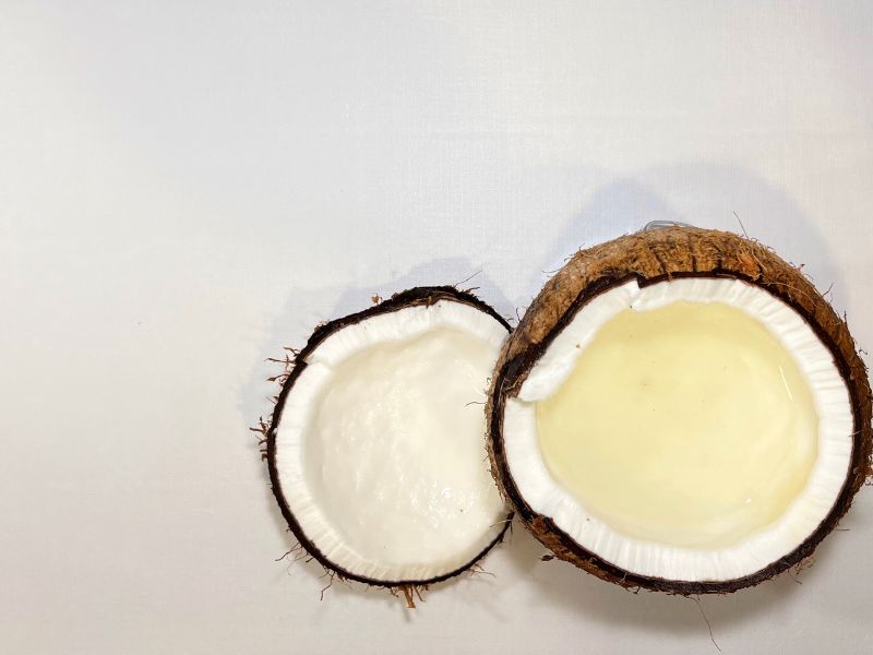 a whole coconut cut in half