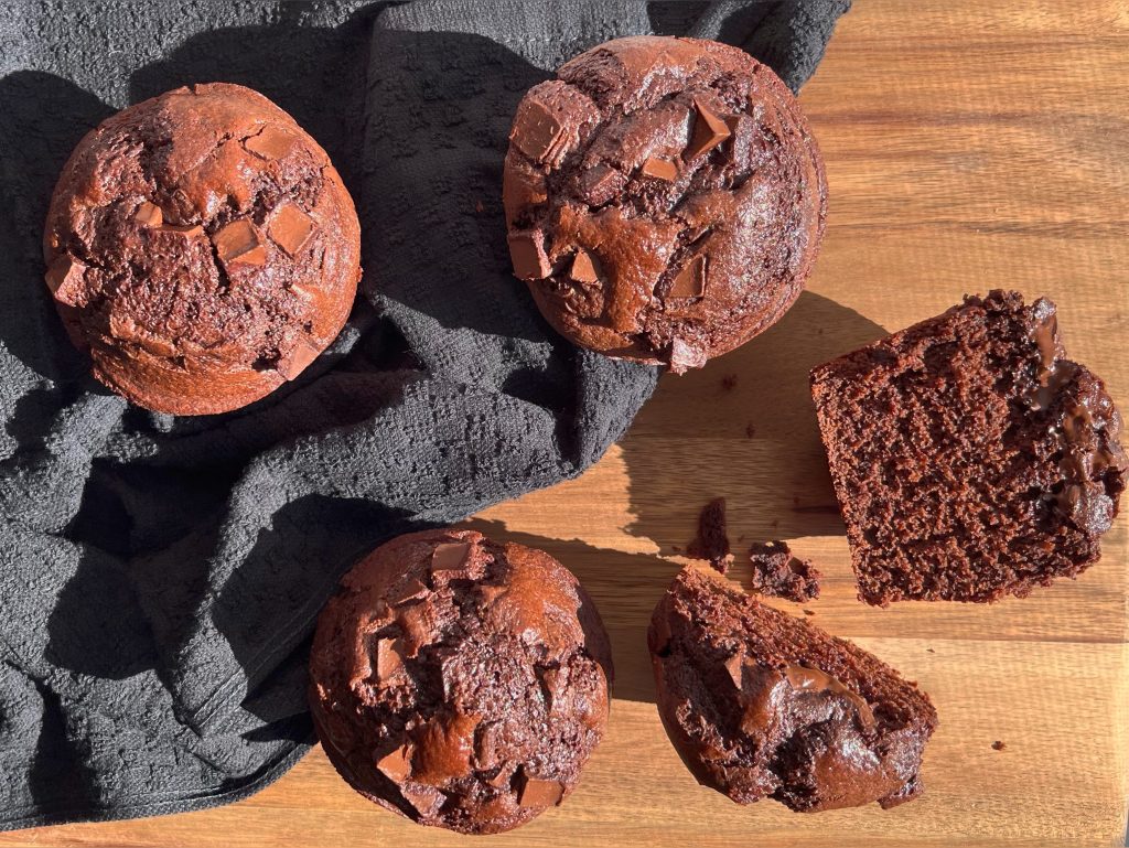 chocolate lactation muffins on a black towel